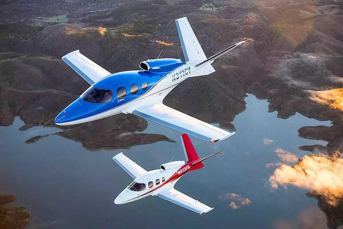 Two Cirrus Vision Jets Flying in Formation