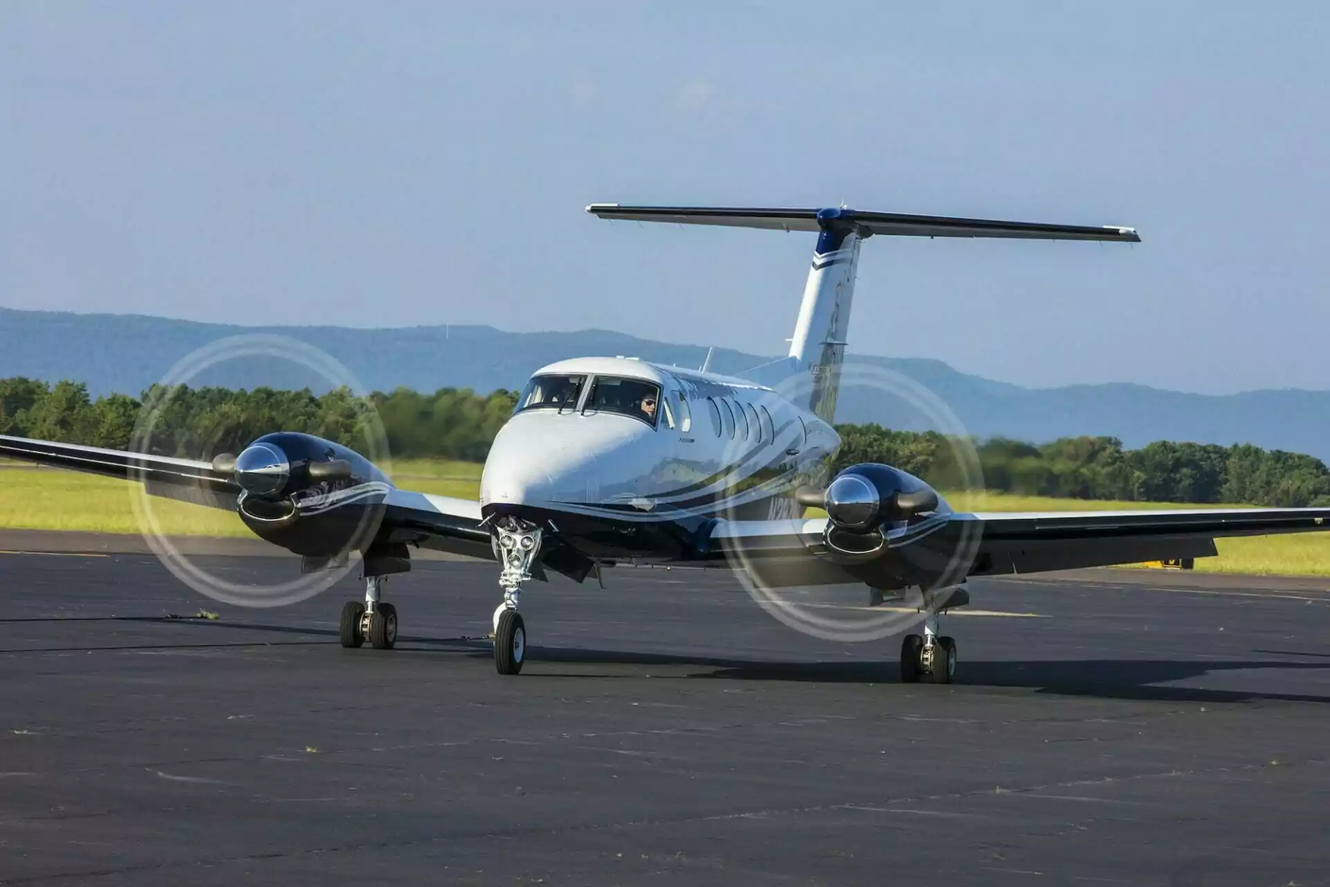 King Air 260 exterior on ground with engines running