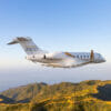 Bombardier Challenger 3500 Exterior during sunset flying over mountains