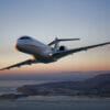 Bombardier Global 6000 Exterior takeoff at sunset with mountains behind