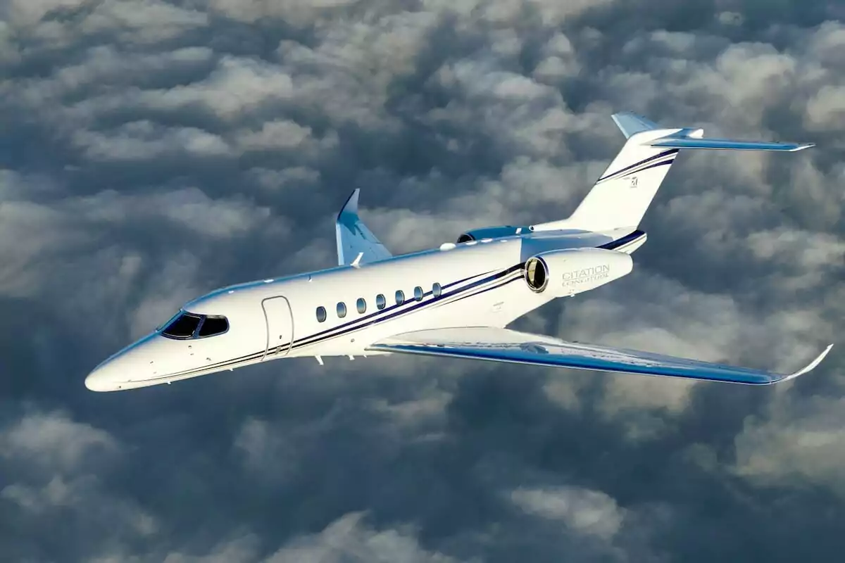 Cessna Citation Longitude Exterior white paint flying above clouds