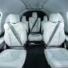 Cirrus Vision Jet SF50 interior looking back at cabin with five seat configuration in white leather
