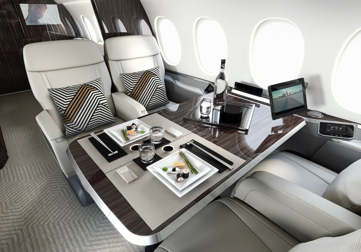Falcon 6X interior club seat with table, private jet from atlanta to miami