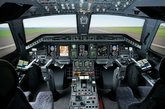 Embraer Legacy 650E Cockpit on runway with avionics powered on