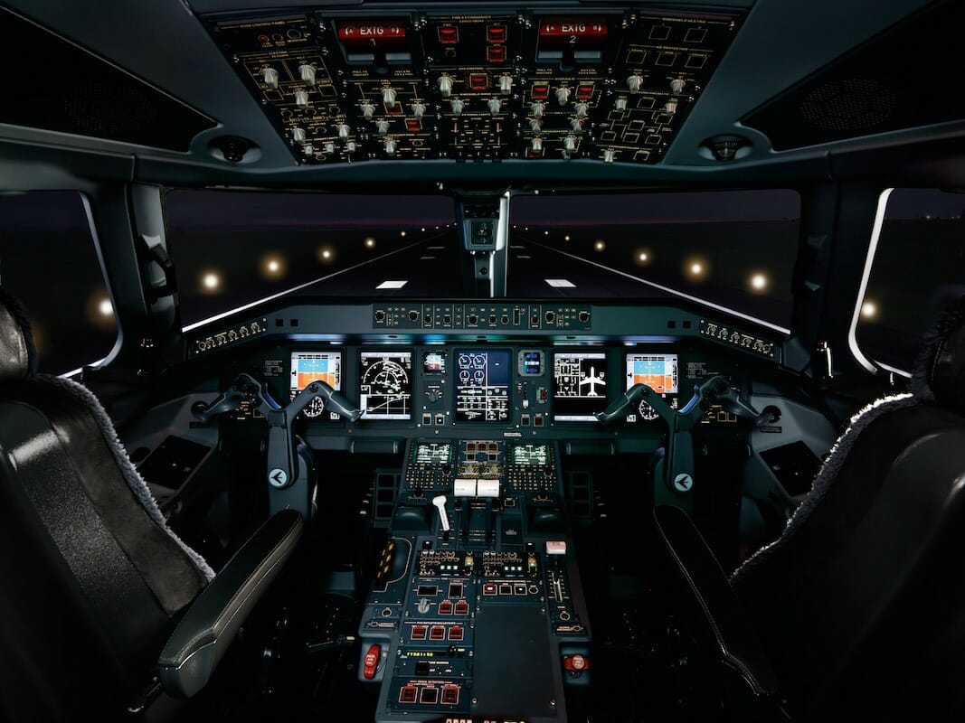 Embraer Lineage 1000E Cockpit Night Time on Runway, powered up avionics