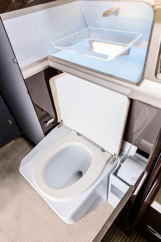 Pilatus PC-24 Interior toilet and sink, toilet is open