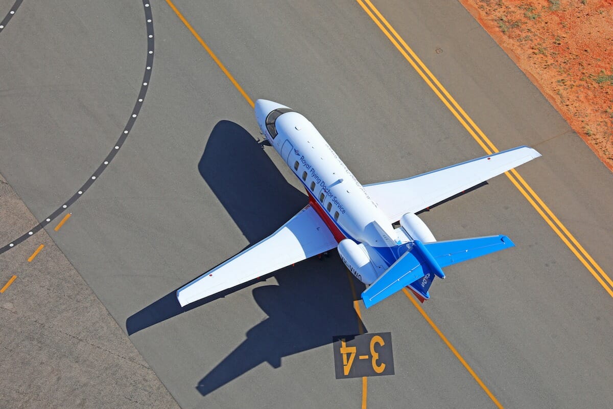 Aerial shot of Pilatus PC-24 taxiing in white paint, royal flying doctor service in australia VH-VWO