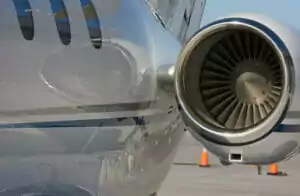 Private jet engine looking back