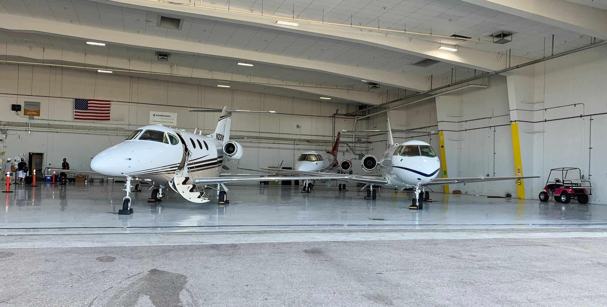 Private jets in airport hangar